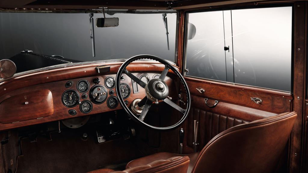 Interior, driver's side view of Bentley 8 litre featuring analogue gauges to centre console and 4 spoke steering wheel.