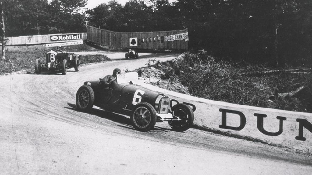Bentley Blower 4.5 litre supercharger, taking a sharp turn on an unpaved race track.