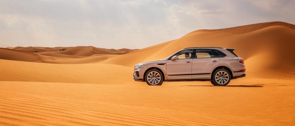 Bentley Bentayga driving in a desert in China 