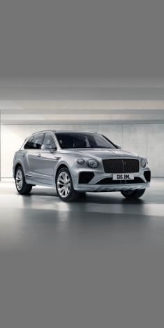 Bentley Bentayga in Moonbeam colour side angled view featuring 21 inch Five Twin-Spoke Wheel-Painted and chrome accent side skirt.