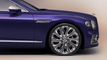 Bentley Flying Spur Mulliner in Tanzanite Purple colour one quarter view featuring 22 inch Mulliner Wheel Painted and Polished and Chrome Flying ‘B’ design fender vents.