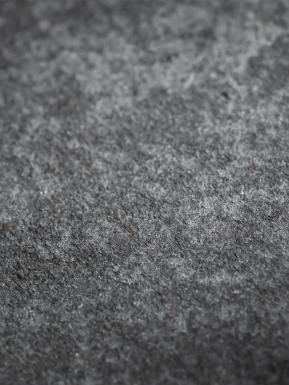 Detailed textured view of grey stone.