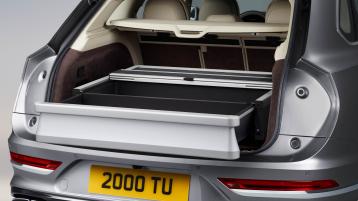 Rear view of Bentley Bentayga EWb, with boot open,featuring Multi Functional Boot Stowage manufactured from Brushed Aluminium