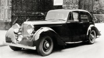 Side angled view of 4.25 Litre Derby Bentley, black exterior featuring halogen lamps and vertical vaned radiator