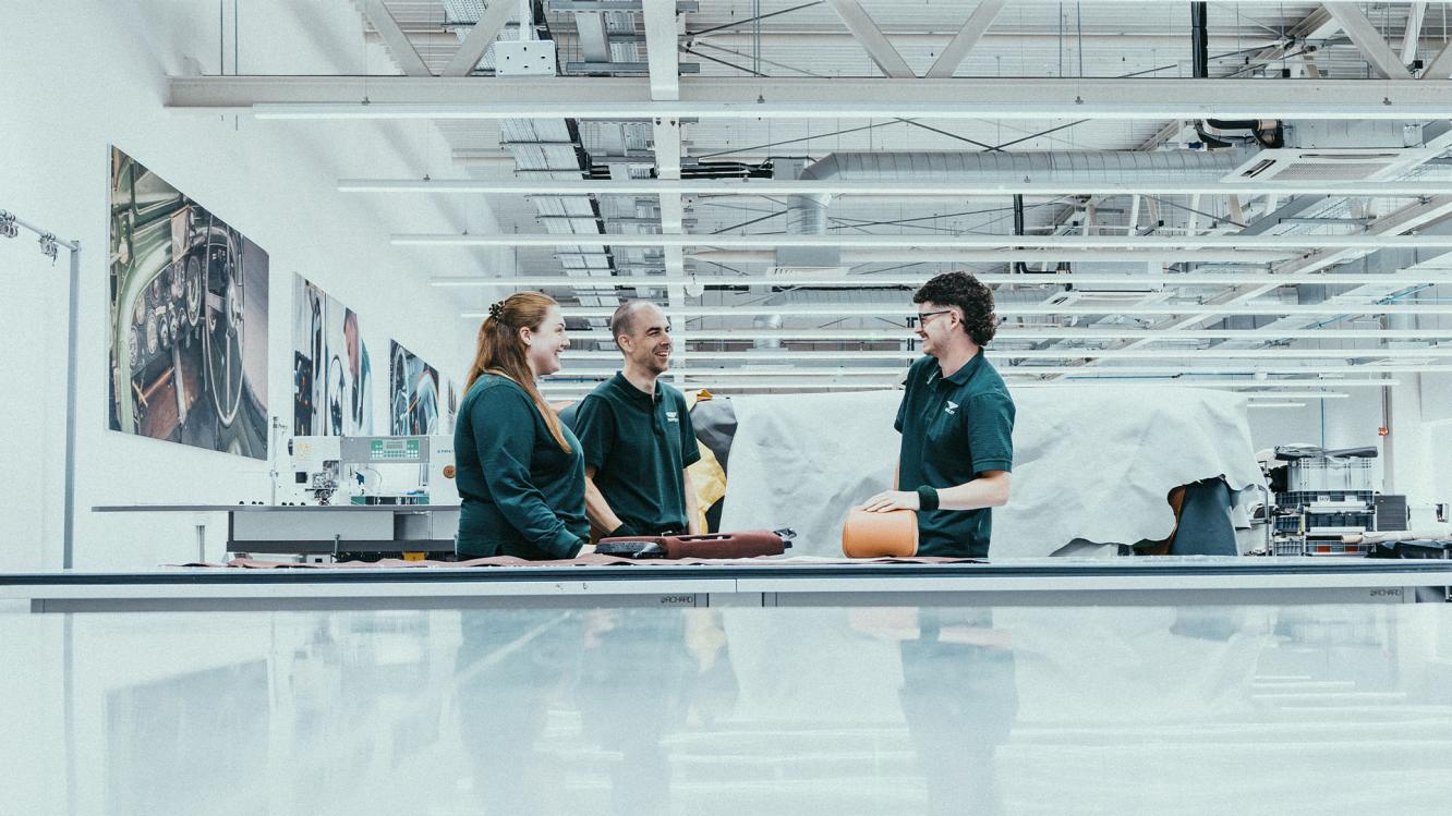 Bentley colleagues talking in the Bentley Dream Factory.