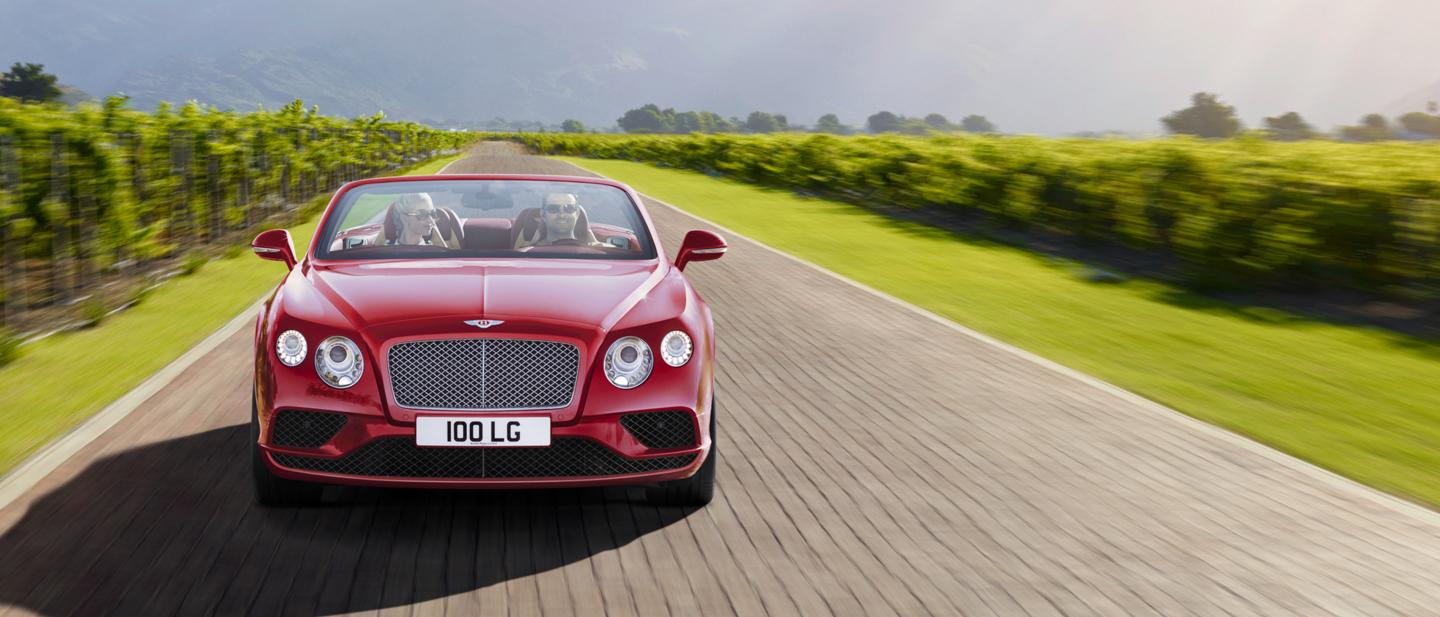 A 2019 Bentley Continental GTC driving in rural environments