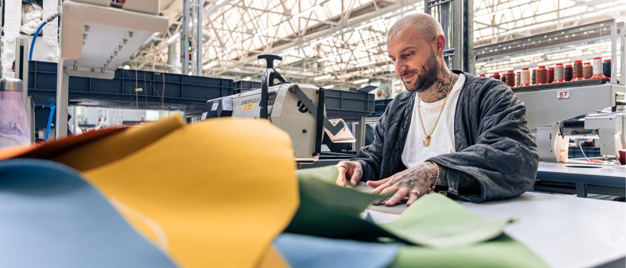 A seamster working on leather hide in Bentley Factory, Crewe.