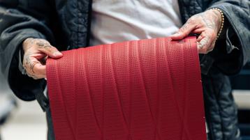 A person holding patterned Hot Spur Hide 