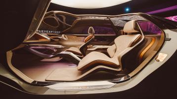 Side view of Bentley EXP 100 GT with door open showing interiror featuring Adaptable Biometric Seating.