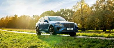 Neptune Bentayga Hybrid parked in a rural location