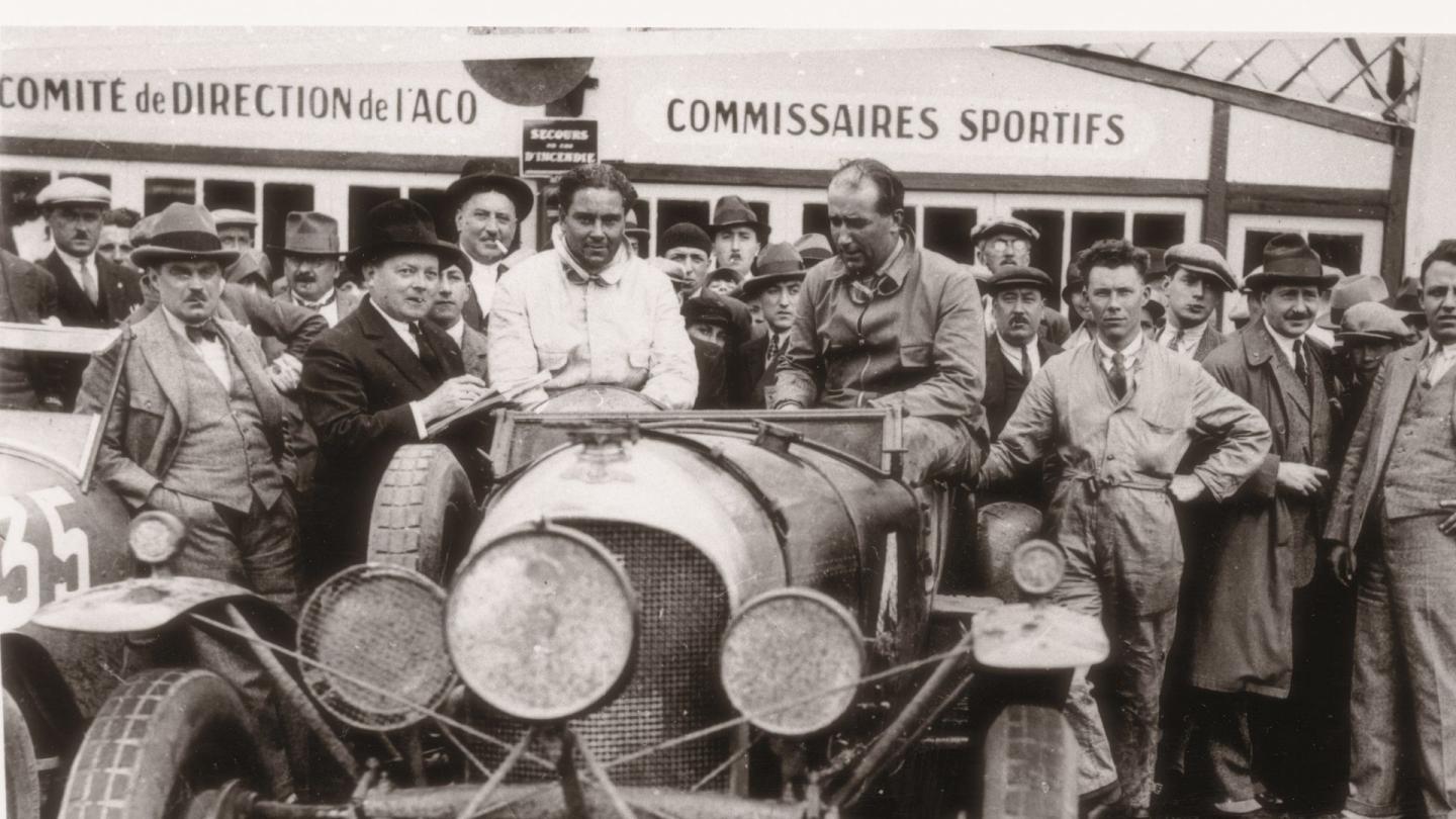 Woolf Barnato sat on his race winning Bentley after the 1928 Le Mans