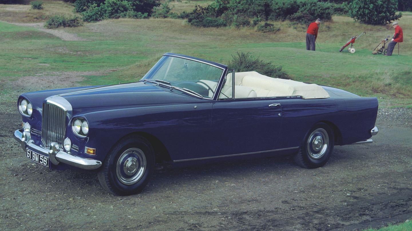 The Bentley S3 parked in on a golf course with a cream interior and blue exterior painted body