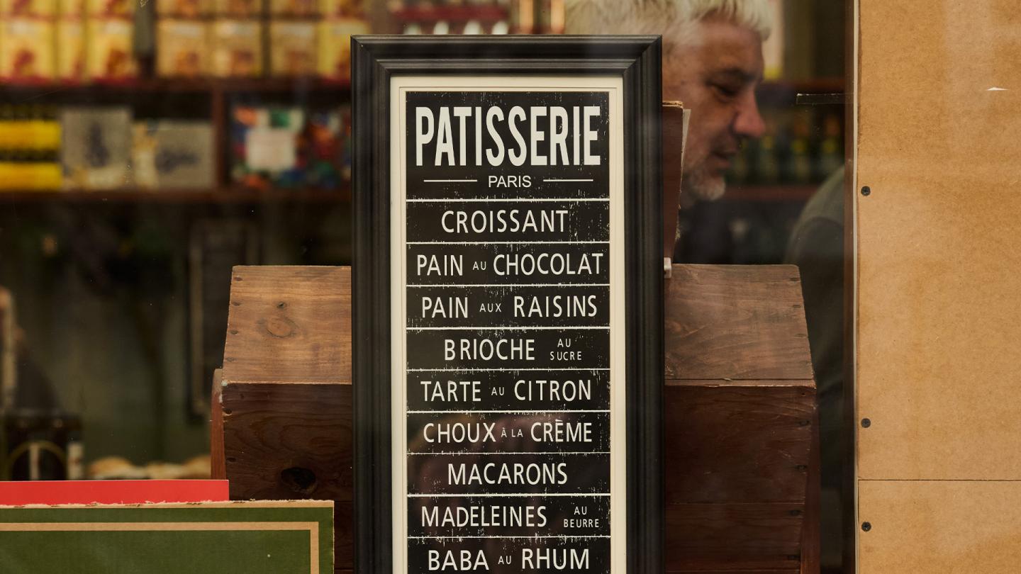 Salvino's menu displayed in their window.