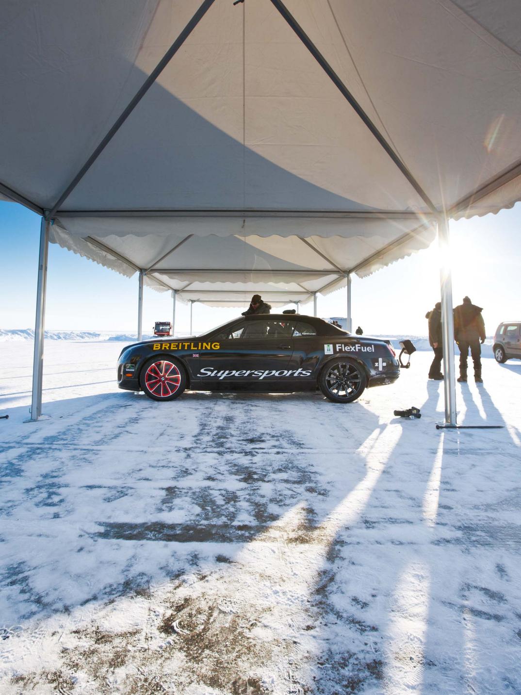 The Bentley Ice Speed Record car on ice and under a tent.