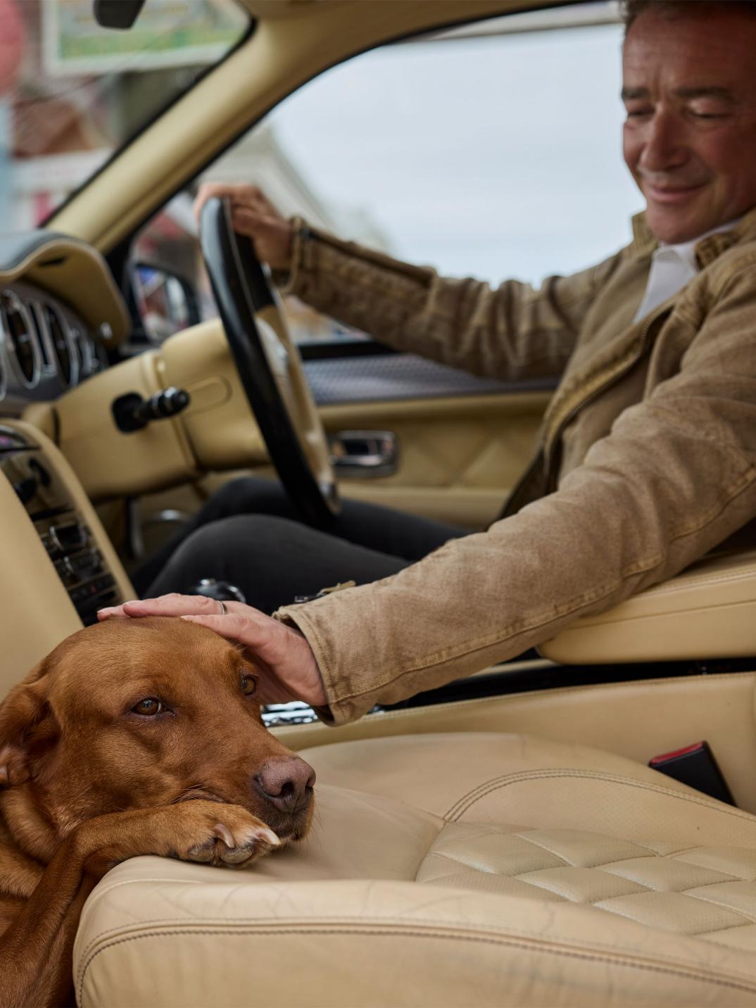 Hubert de Pelet sat in the driver's seat and his dog in the passenger footwell of his Bentley Arnage T.