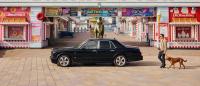 Hubert de Pelet walking with his dog towards his Bentley Arnage T on a pier.