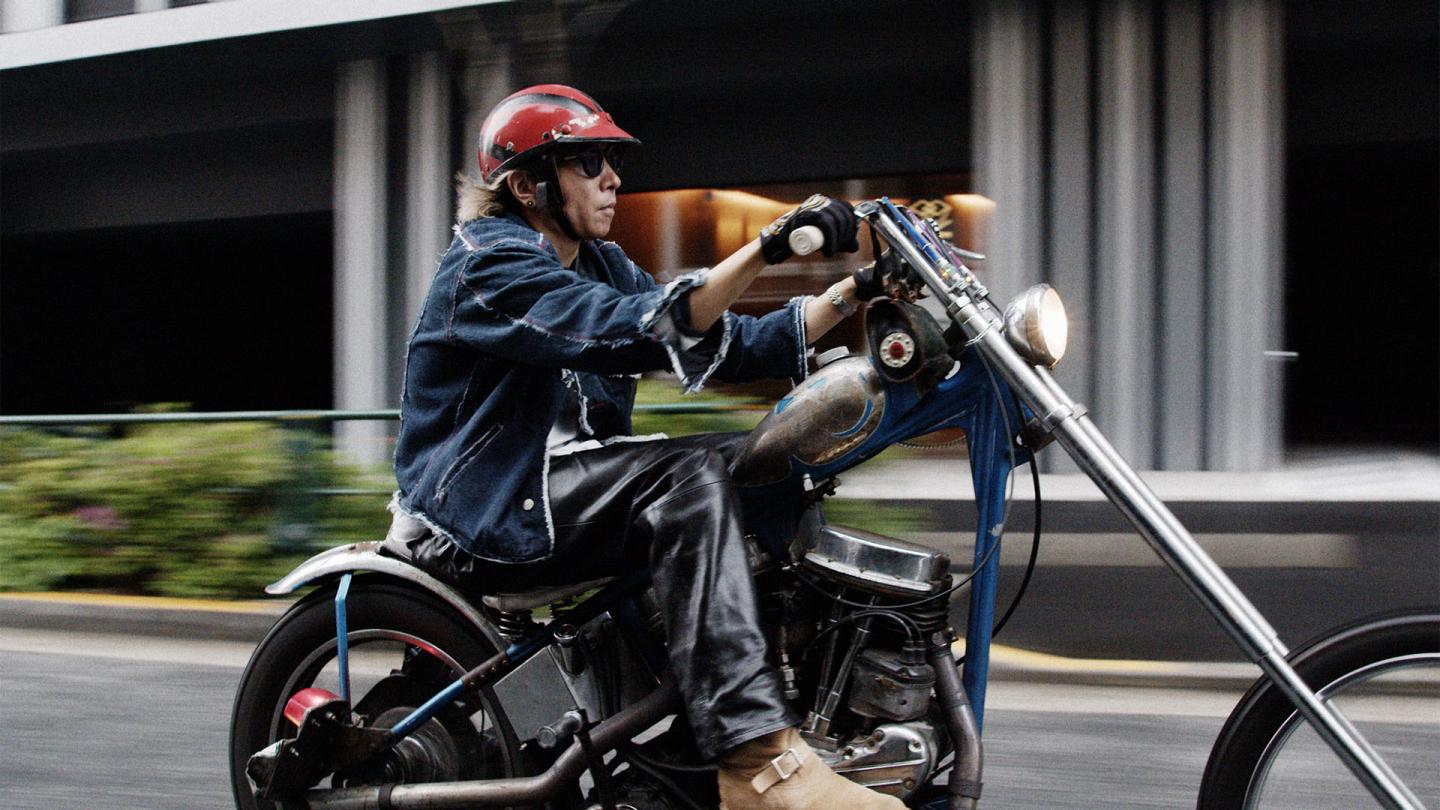 Kota riding his motorbike.