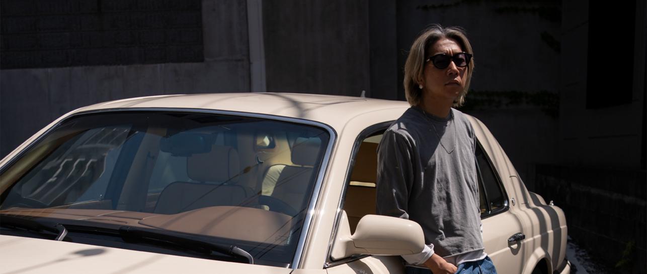 Kota Engaku stood leaning against his Bentley Arnage.