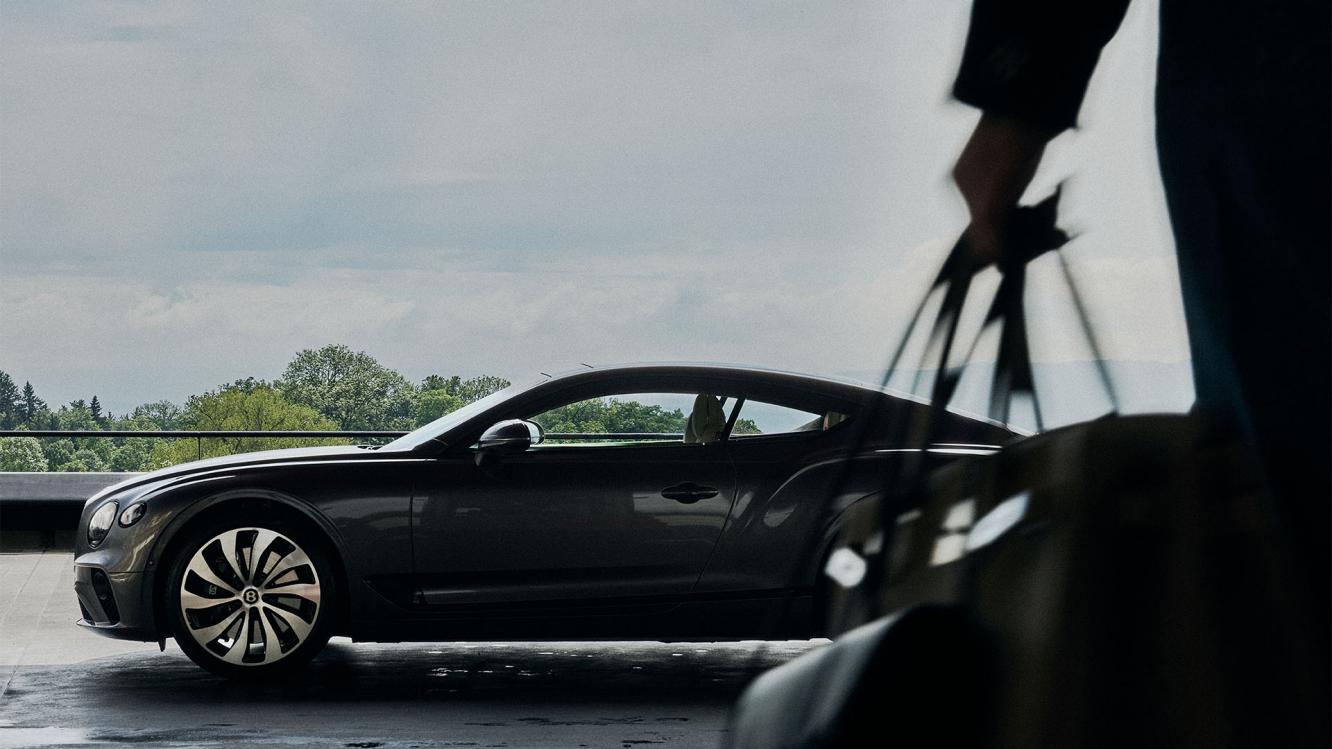 Layla Hajrovic walking towards her Bentley Continental GT.