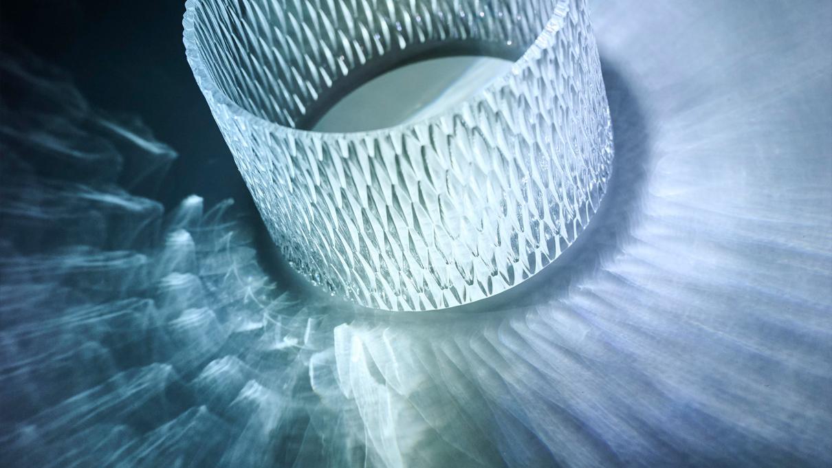 Close up of a diamond glass with light shining through it.