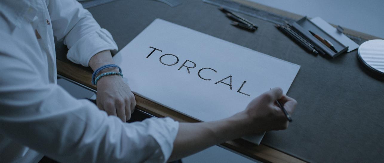 Torcal being written on a piece of paper.