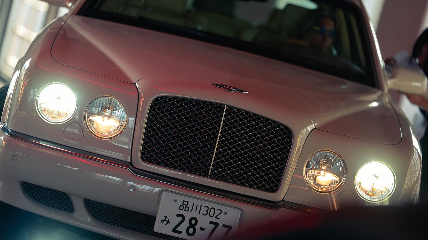 Close up of a Bentley at Coffee and Cars event.