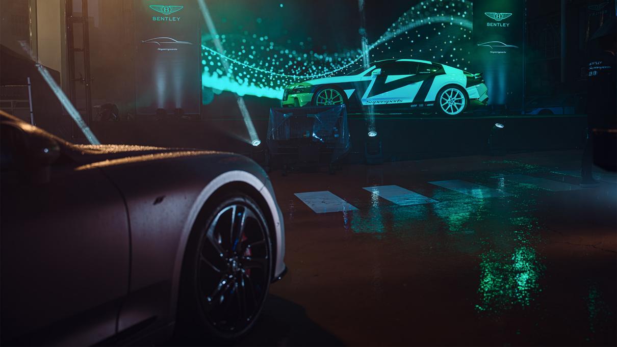 Front end of the Bentley Continental GT S, with the Bentley Supersports on stage in front.