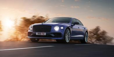 Dark Purple Flying Spur, featuring black line package on a country road at dusk.
