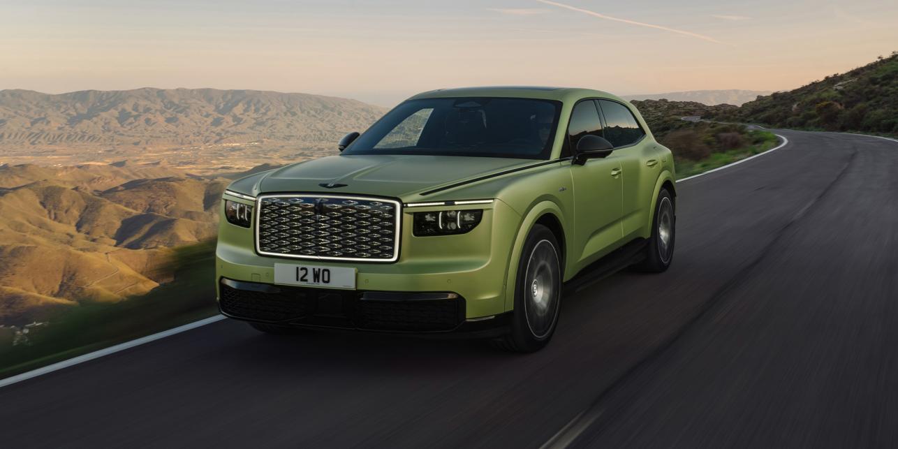 The all-new Bentley Torcal in Electrum Satin exterior paint driving dynamically on a rural road