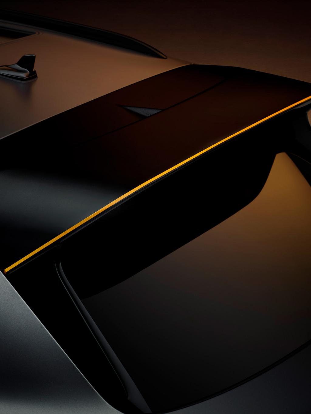 Close up of the black spoiler with a Mandarin pinstripe available on the Bentayga S Black Edition
