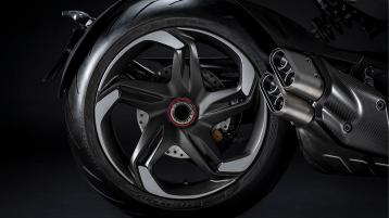 5 spoked Alloy rear wheel set in  Dark Titanium Satin colour and performance exhaust muffler of Bentley Diavel V4 in view. 