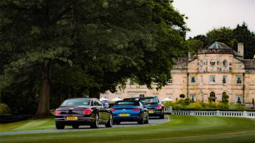 A convoy of Bentley Continental GT and Bentley Flying Spur entering Grantley Hall.