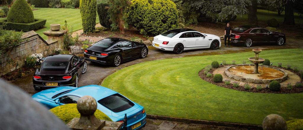 A convoy of Bentley Continental GT and Bentley Flying Spur lining up to embark on Bentley Extra Ordinary Journey UK.