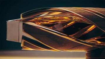 The Macallan Horizon bottle with 180 degrees twist featuring brushed aluminium casing enclosing wood.