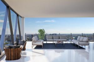 Bentley Residence Miami, with Bentley Home furniture on balcony overlooking the ocean.