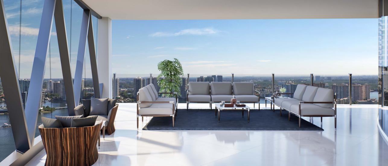 Bentley Residence Miami, with Bentley Home furniture on balcony overlooking the ocean.