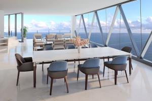 Bentley Residence Miami, with Bentley Home furniture on balcony overlooking the ocean.