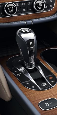 Zoomed in Bentley Bentayga EWB Azure interior central console set in Open Pore Koa veneer