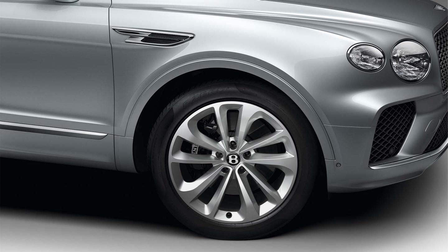 Bentley Bentayga EWB in Moonbream colour featuring 21 inch Five Twin-Spoke Wheels-Painted and lower Matt Black matrix grille.