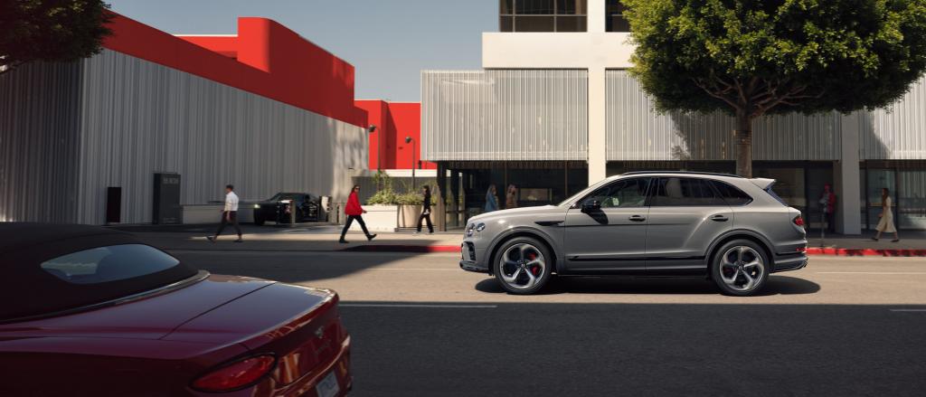 Bentley Bentayga S in Cambrian Grey colour, side angled view featruing red brake callipers and S emblem.