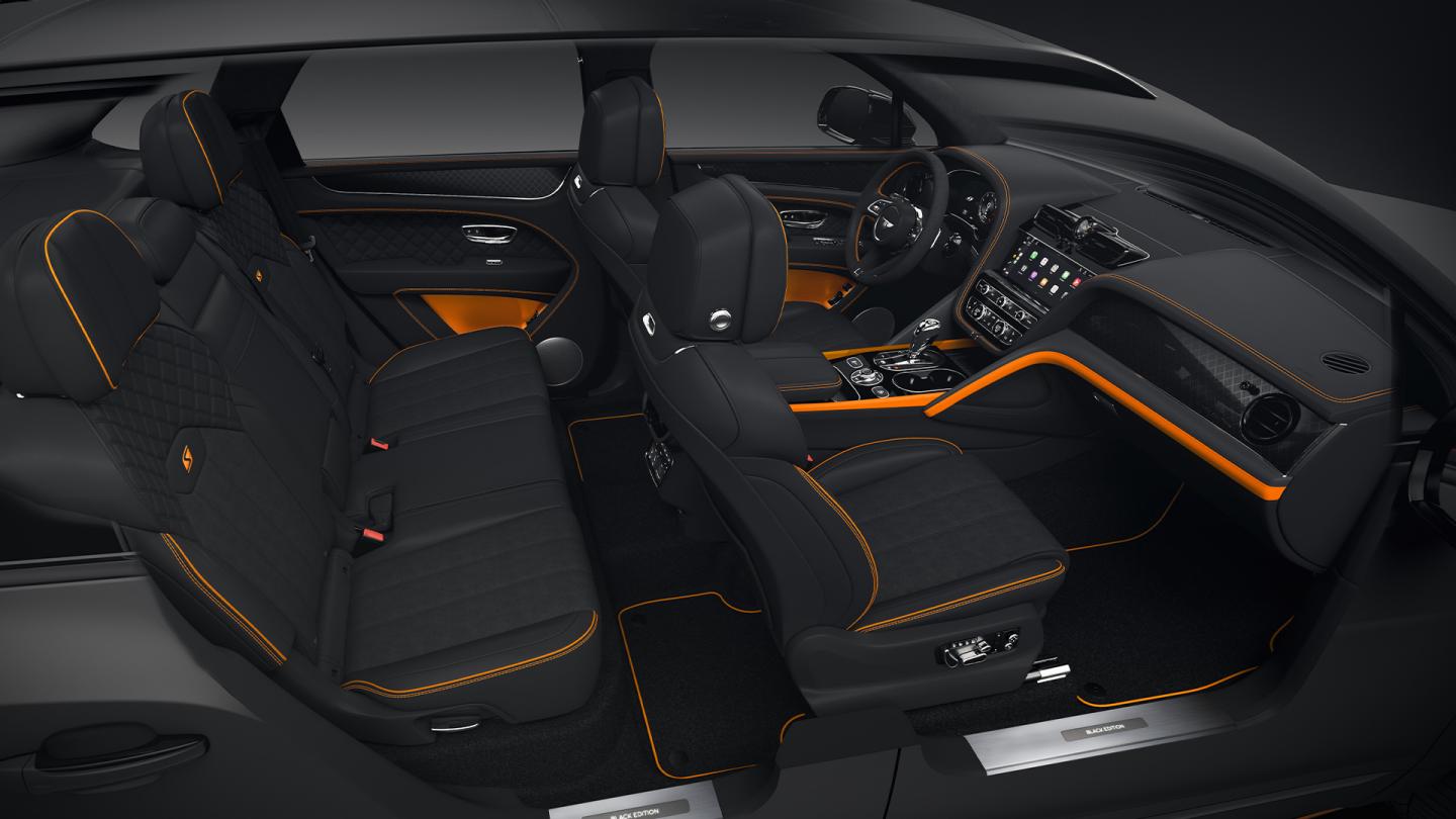 Full interior cabin overview of the Bentayga S Black Edition feature Beluga hide and mandarin contrasting trim