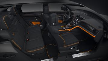 Full interior cabin overview of the Bentayga S Black Edition feature Beluga hide and mandarin contrasting trim