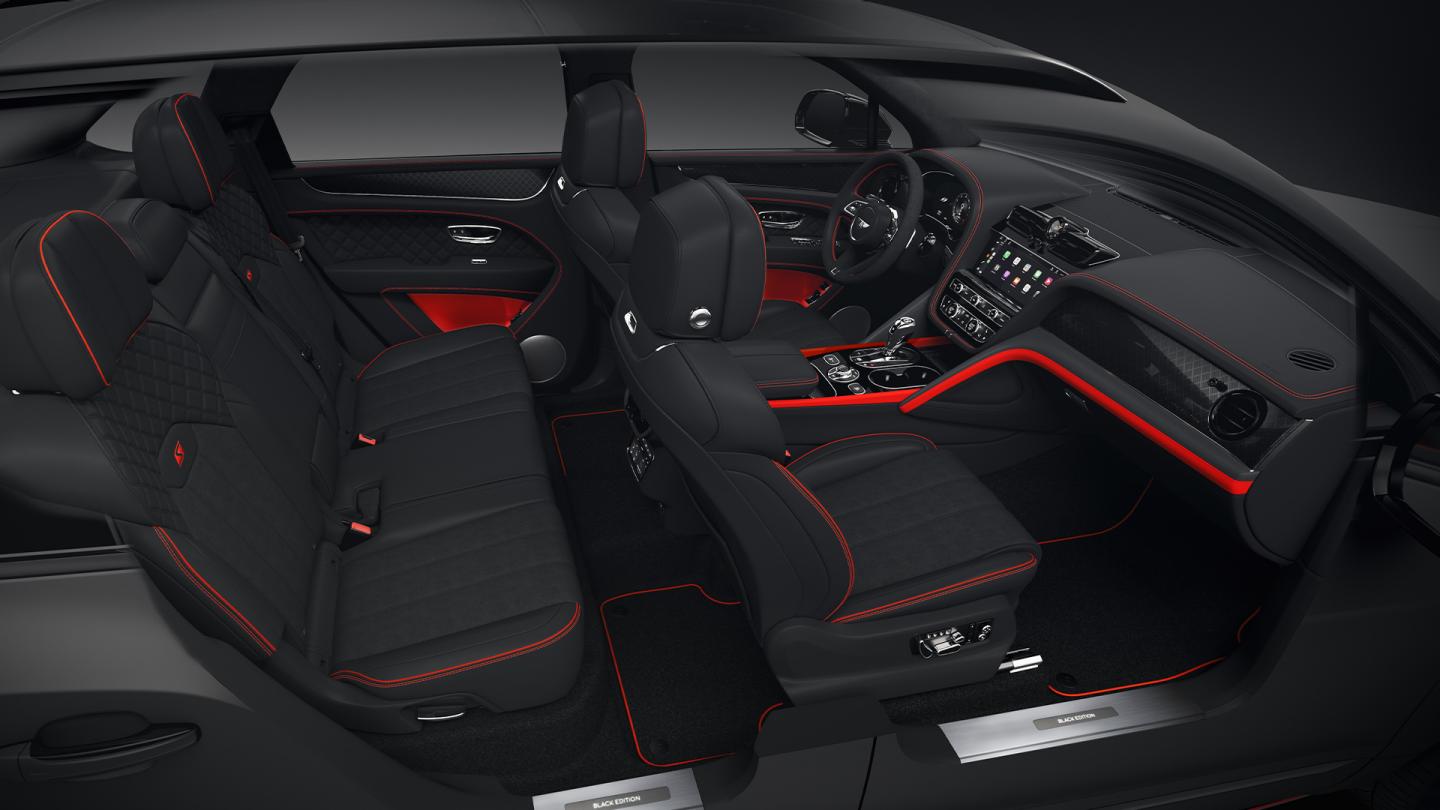 Full interior cabin overview of the Bentayga S Black Edition feature Beluga hide and Pillar Box Red contrasting trim