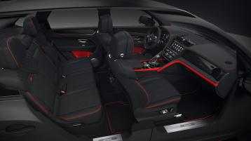 Full interior cabin overview of the Bentayga S Black Edition feature Beluga hide and Pillar Box Red contrasting trim