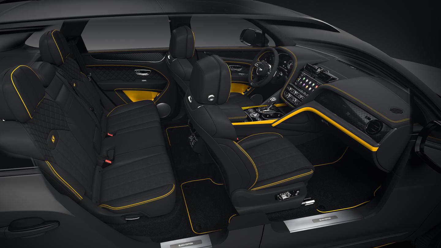 Full interior cabin overview of the Bentayga S Black Edition feature Beluga hide and Signal Yellow contrasting trim