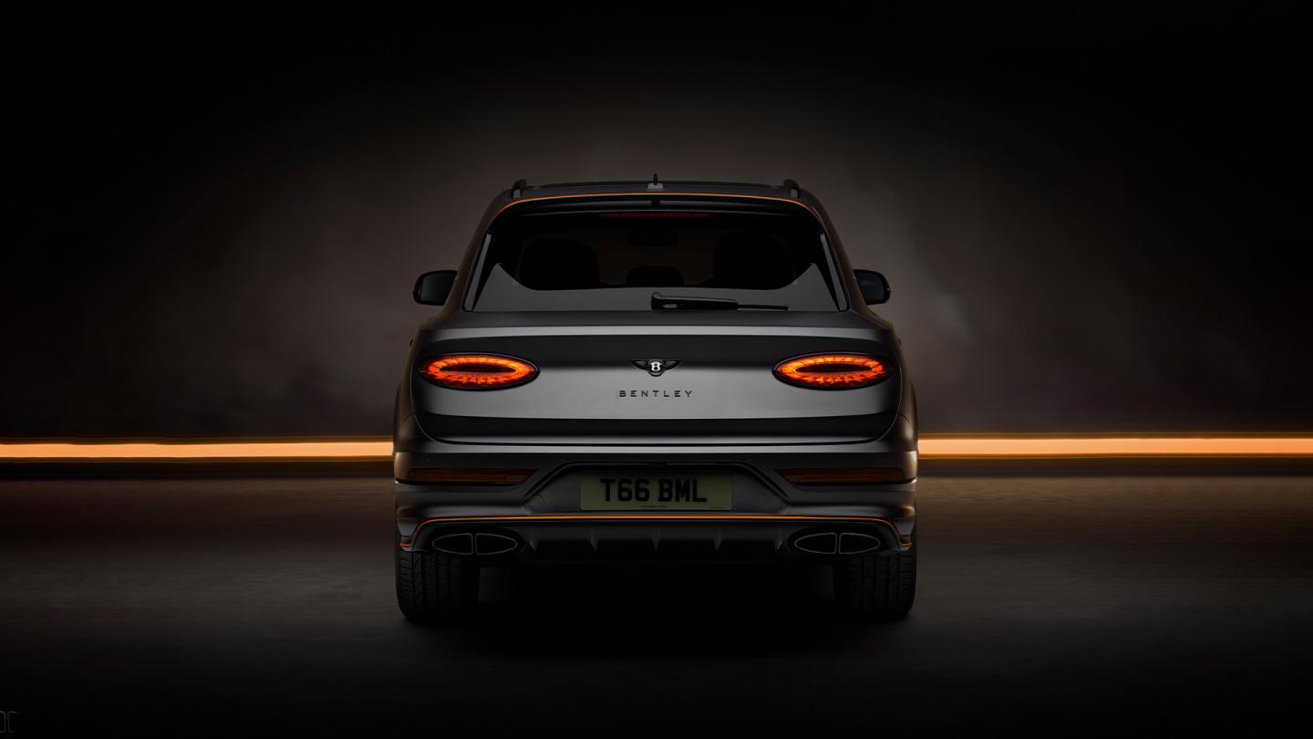 Bentley Bentayga S Black Edition rear profile featuring 22 inch S directional wheel - Black Painted and Polished as well as Mandarin accents on the styling kit