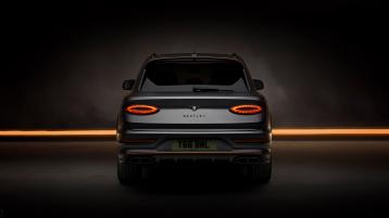 Bentley Bentayga S Black Edition rear profile featuring 22 inch S directional wheel - Black Painted and Polished as well as Mandarin accents on the styling kit