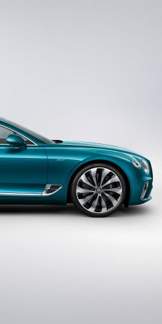 Front side quarter view of Bentley Continental GT Azure in Topaz Blue colour featuring Bright wing vent with black ribbed matrix and 22" Ten Spoke Wheels. 