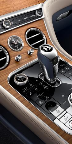 Bentley Continental GT Azure V8 central console in Open Pore Koa Veneer with 8 Speed Dual clutch tranmission lever in view.