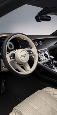 Close up on Bentley Continental GT Mulliner's Heated, Duo-Tone Linen and Beluga hide, 3 Spoke, Hide Trimmed Steering Wheel